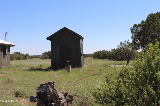 exterior space with a shed