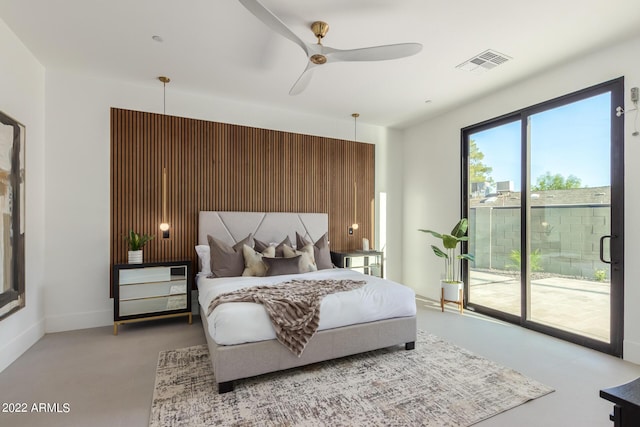 bedroom featuring ceiling fan and access to exterior