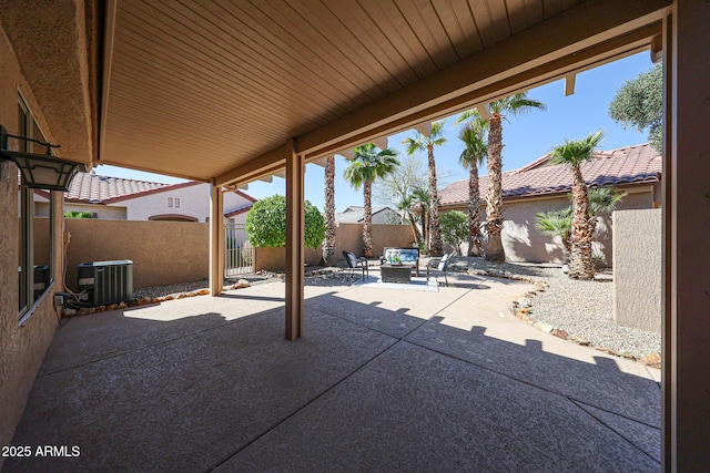 view of patio featuring an outdoor living space, central AC, and a fenced backyard