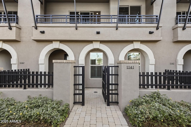 entrance to property with a balcony