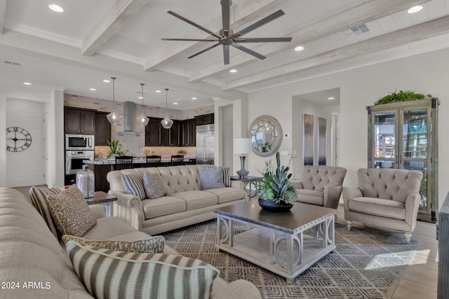 living room featuring ceiling fan, dark hardwood / wood-style flooring, and beamed ceiling