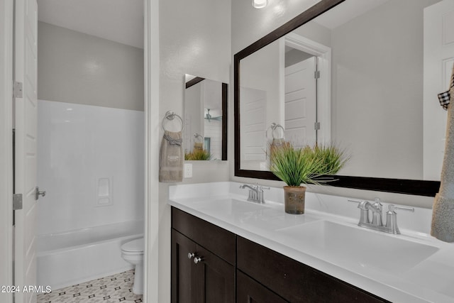 full bathroom featuring toilet, vanity, and shower / bathtub combination