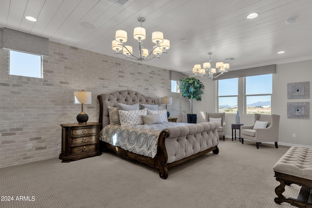 bedroom featuring an inviting chandelier, brick wall, and carpet