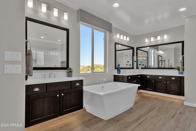 bathroom featuring separate shower and tub, vanity, and crown molding