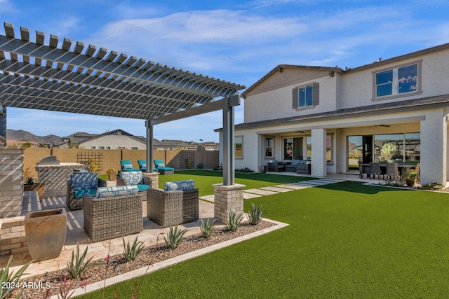 exterior space with an outdoor hangout area, a pergola, and ceiling fan