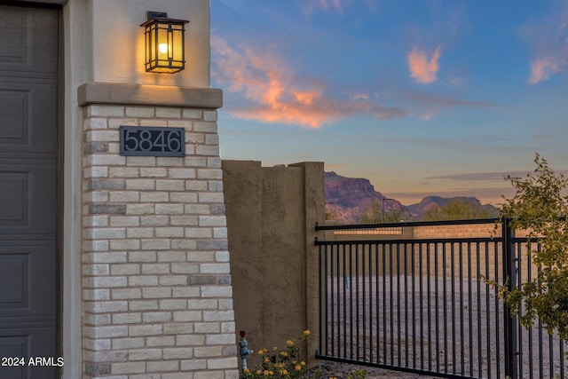 gate at dusk with a mountain view