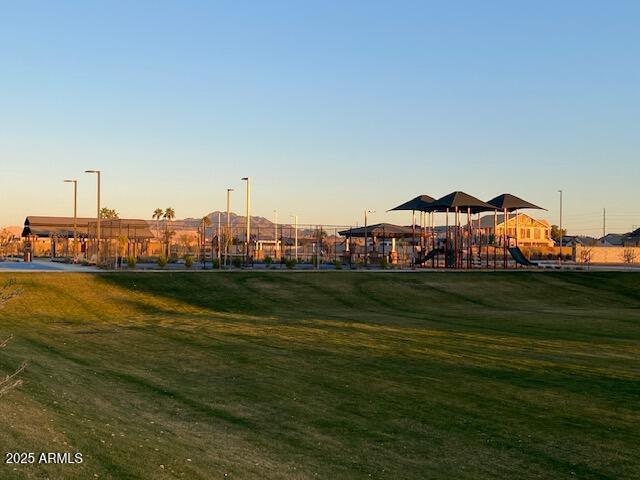 view of community featuring a yard and a playground