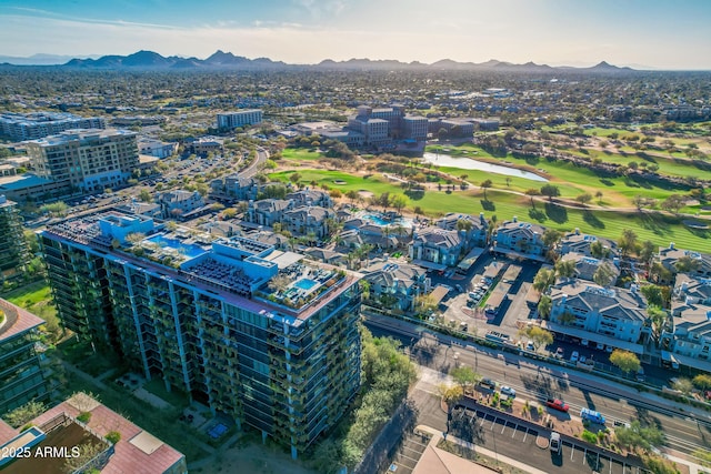 bird's eye view featuring a mountain view, a view of city, and view of golf course