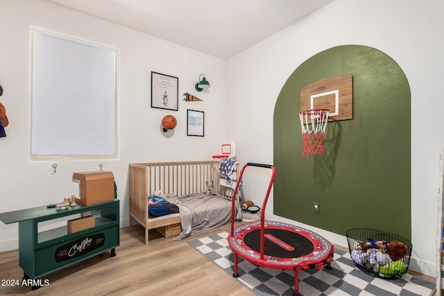 bedroom featuring wood finished floors