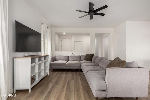 living room featuring ceiling fan and wood finished floors