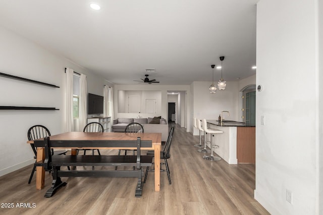dining area featuring light wood-style flooring, visible vents, baseboards, recessed lighting, and ceiling fan