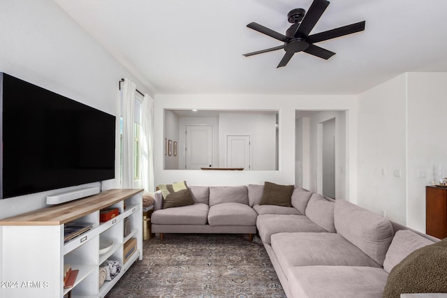 living room featuring a ceiling fan