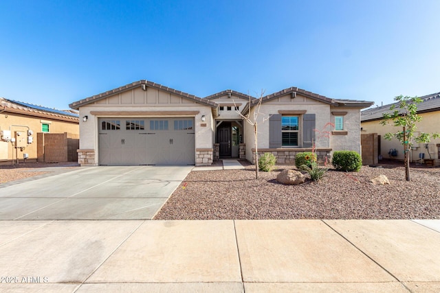 17311 W Seldon Ln, Waddell, AZ 85355 - craftsman house featuring driveway, an attached garage, stucco siding, fence, and stone siding