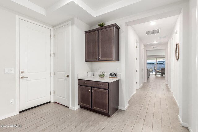 17311 W Seldon Ln, Waddell, AZ 85355 - corridor with light wood-style flooring and baseboards