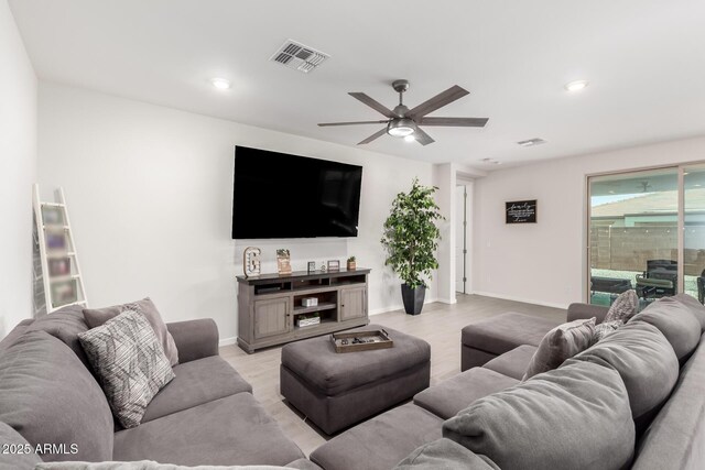 17311 W Seldon Ln, Waddell, AZ 85355 - living area with ceiling fan, light wood-type flooring, recessed lighting, and baseboards