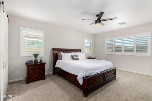 17311 W Seldon Ln, Waddell, AZ 85355 - bedroom with light colored carpet, a ceiling fan, and baseboards