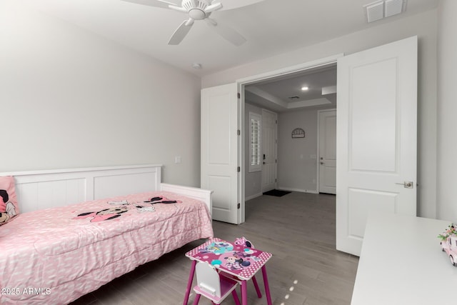 17311 W Seldon Ln, Waddell, AZ 85355 - bedroom with wood finished floors and a ceiling fan