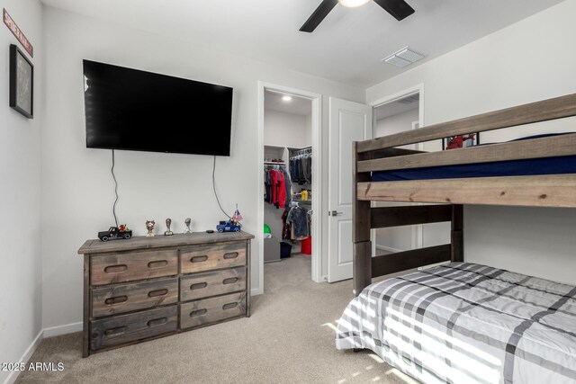 17311 W Seldon Ln, Waddell, AZ 85355 - bedroom with a spacious closet, carpet flooring, a closet, baseboards, and ceiling fan