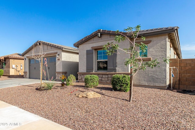 17311 W Seldon Ln, Waddell, AZ 85355 - view of front of house with driveway, stucco siding, a tile roof, and a garage