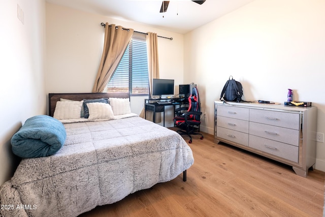 bedroom with a ceiling fan, visible vents, and light wood-style floors