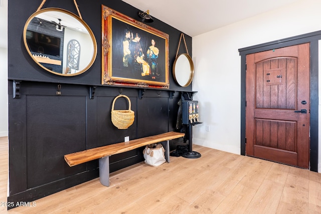 entryway with wood finished floors and baseboards