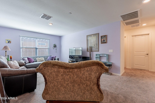 living room featuring recessed lighting, baseboards, visible vents, and carpet