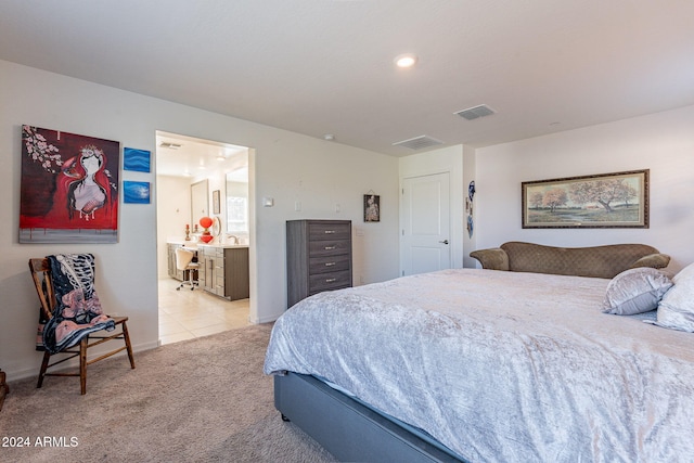 bedroom featuring carpet flooring, connected bathroom, and visible vents