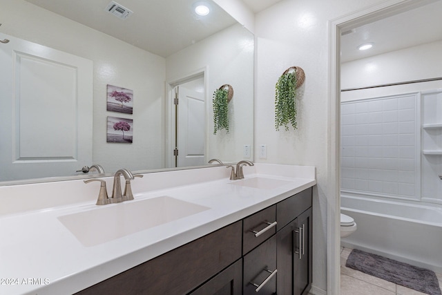 full bathroom with vanity, toilet, tile patterned floors, and washtub / shower combination