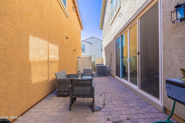 view of patio / terrace with central AC, fence, and outdoor dining space