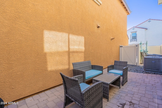 view of patio / terrace with fence and cooling unit