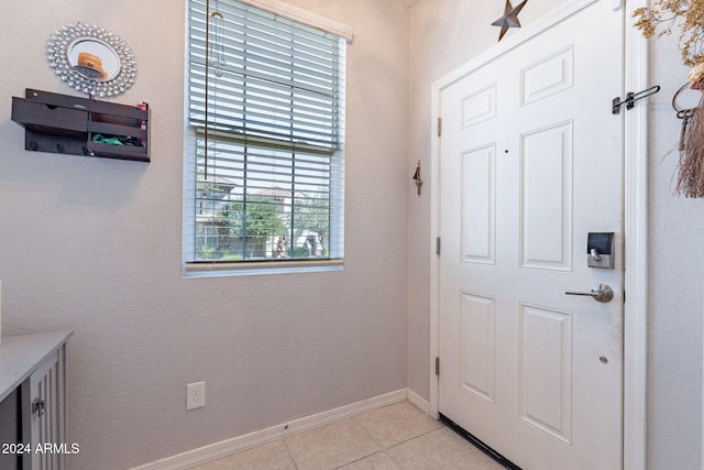 entrance foyer featuring light tile patterned flooring