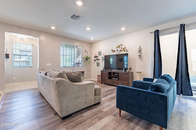 living room featuring visible vents, recessed lighting, and light wood-style flooring