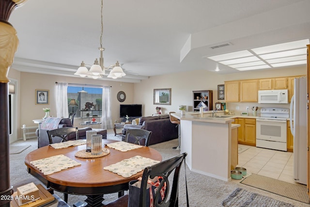 11360 E Keats Ave Unit 20, Mesa, AZ 85209 - dining room featuring a chandelier, light tile patterned floors, and light carpet