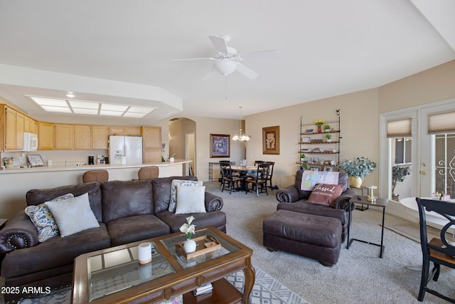 11360 E Keats Ave Unit 20, Mesa, AZ 85209 - living area featuring light carpet, a chandelier, arched walkways, and a ceiling fan