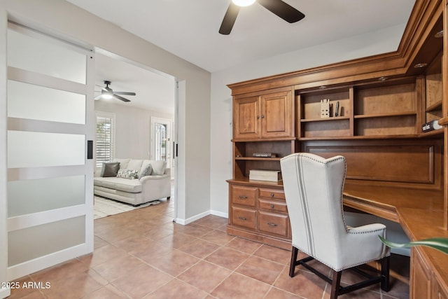 home office with ceiling fan and light tile patterned flooring