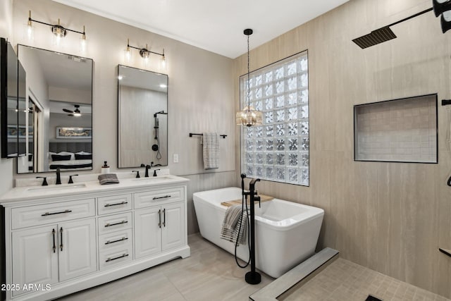 bathroom with vanity, shower with separate bathtub, and ceiling fan