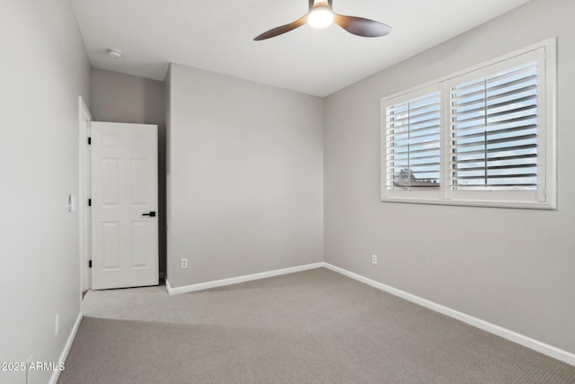 empty room with light carpet and ceiling fan