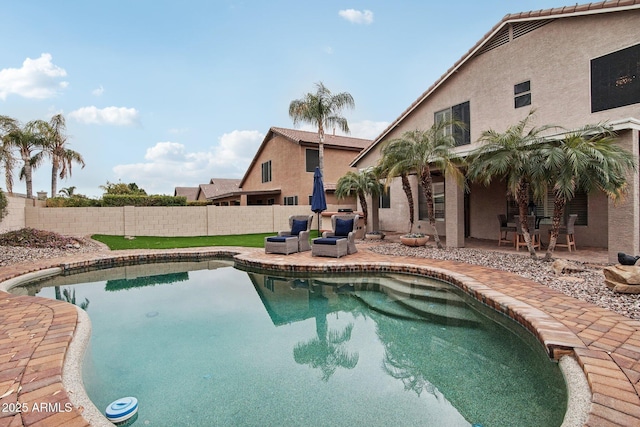 view of swimming pool with an outdoor living space and a patio