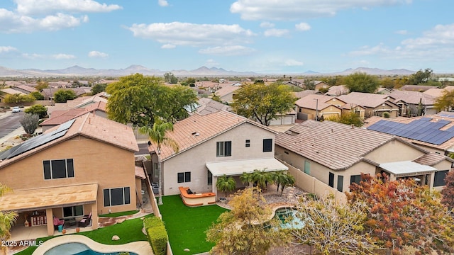 birds eye view of property featuring a mountain view