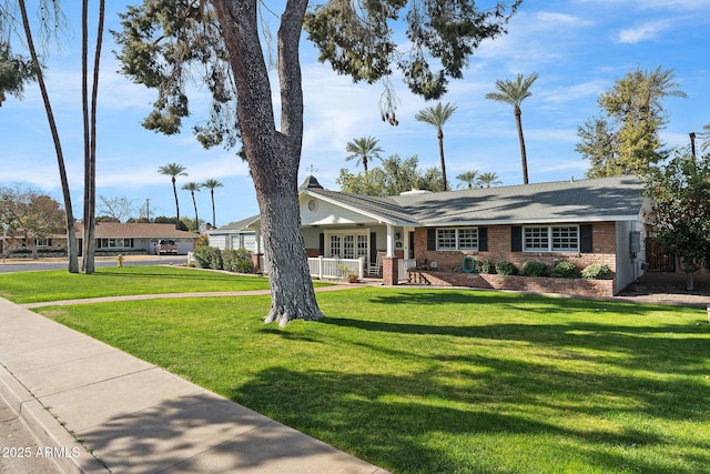 ranch-style house with a front lawn