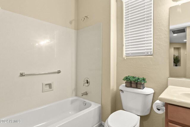 full bathroom with bathtub / shower combination, toilet, and vanity