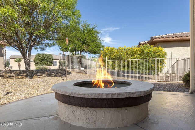 view of patio with an outdoor fire pit