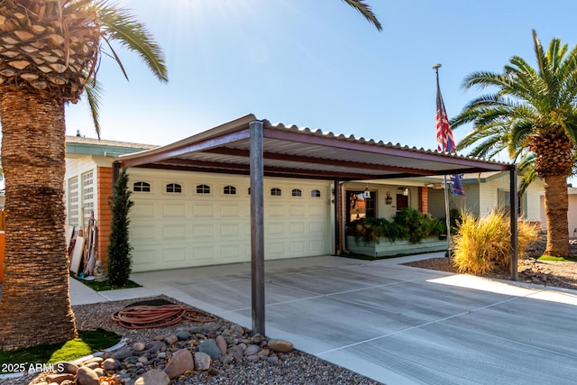 view of front of house with a carport and a garage