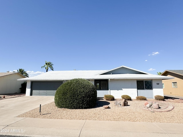 ranch-style house featuring a garage