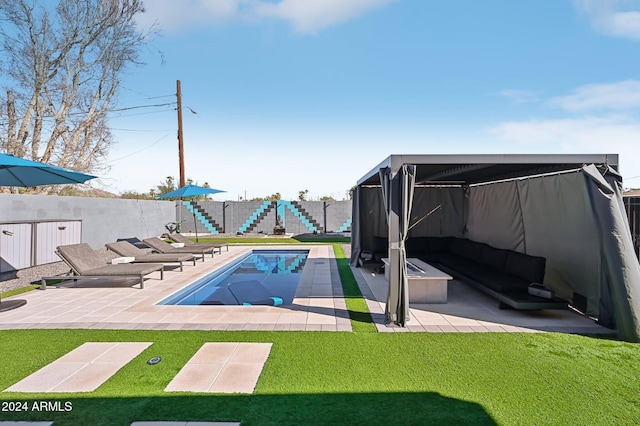view of swimming pool with a patio area
