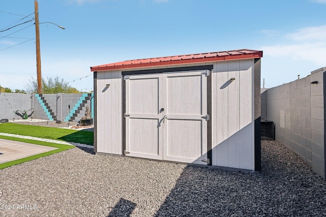 view of shed featuring a fenced backyard