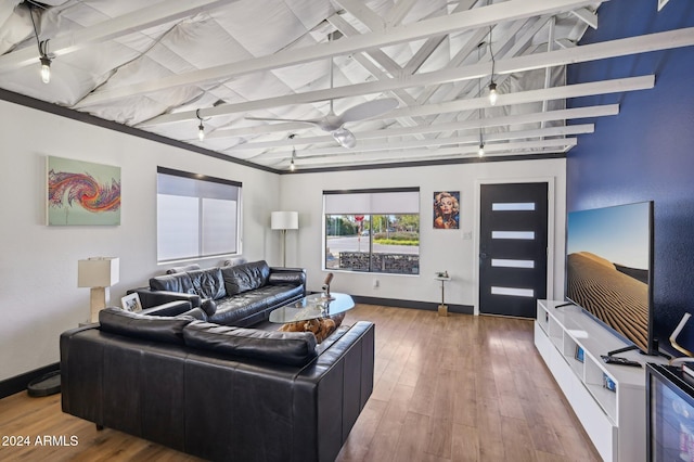 living area with baseboards and wood-type flooring
