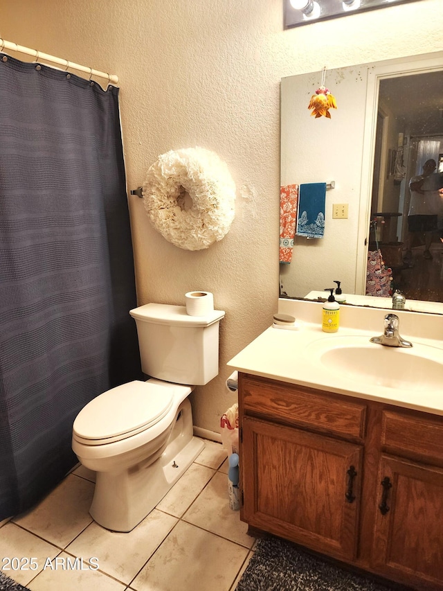 5136 E Evergreen St Unit 1053, Mesa, AZ 85205 - bathroom featuring vanity, tile patterned flooring, a textured wall, and a shower with curtain