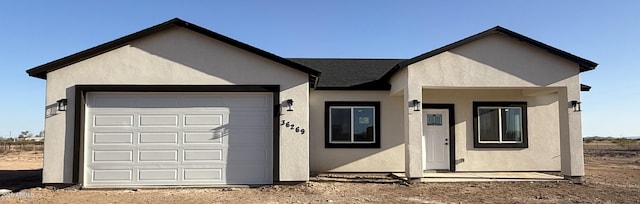 36269 W Highland Ave, Phoenix, AZ 85033 - single story home featuring stucco siding, an attached garage, and roof with shingles