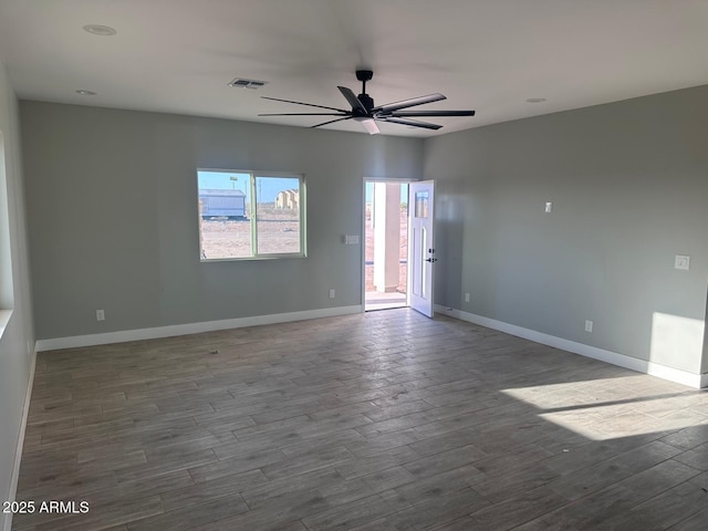36269 W Highland Ave, Phoenix, AZ 85033 - empty room featuring ceiling fan, wood finished floors, and baseboards